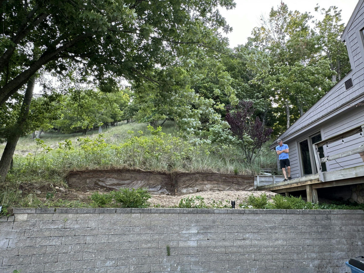 Rotting timber retaining wall before replacement
