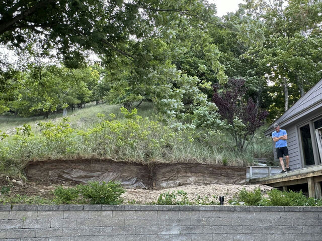 Rotting timber retaining wall before replacement