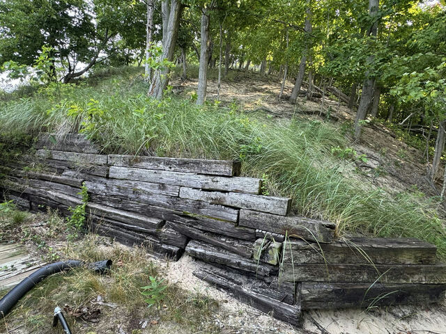 Rotting timber retaining wall before replacement