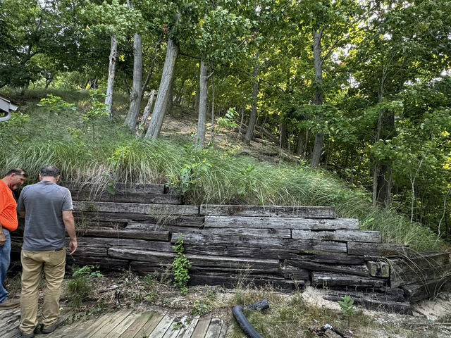 Rotting timber retaining wall before replacement
