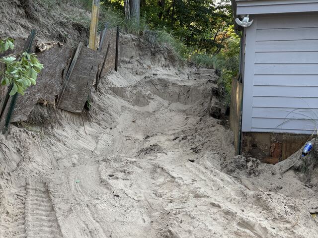 Removing the old wall and excavating the slope