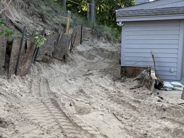 Removing the old wall and excavating the slope