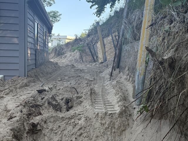 Removing the old wall and excavating the slope