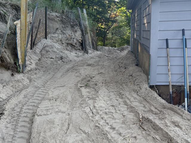 Removing the old wall and excavating the slope